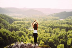 A woman on top of a mountain.