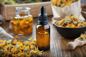 CBD oil with ingredients on a table.