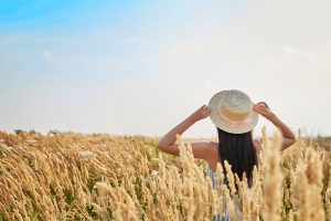 A girl in a field during a fine sunny day in Miami, FL. Buy CBD Oil In Miami, FL