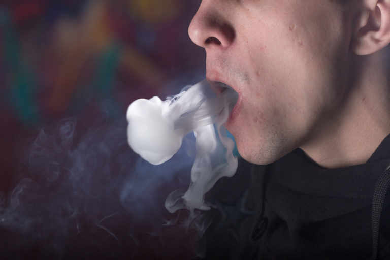 Man smoking salt nicotine