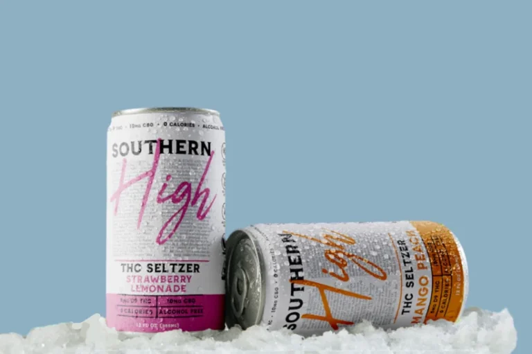 two cans of cannabis beverage in the snow