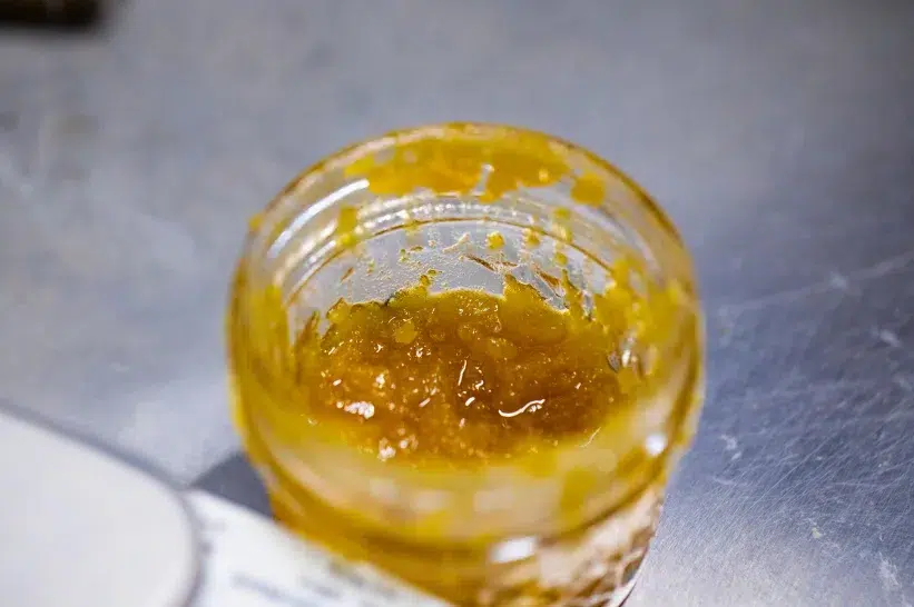 a contain filled with sticky liquid diamonds THC