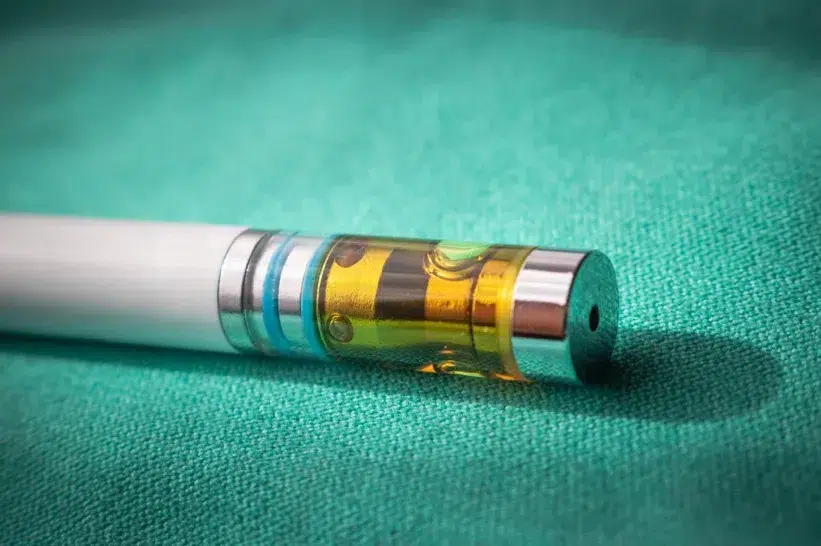 a close up of a liquid diamond THC cartridge