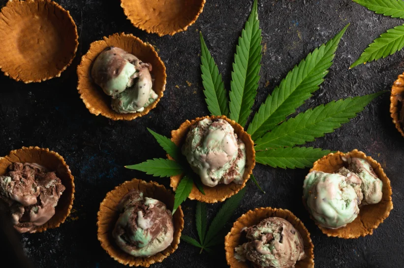 a group of ice cream in a bowl with THCA flowers.