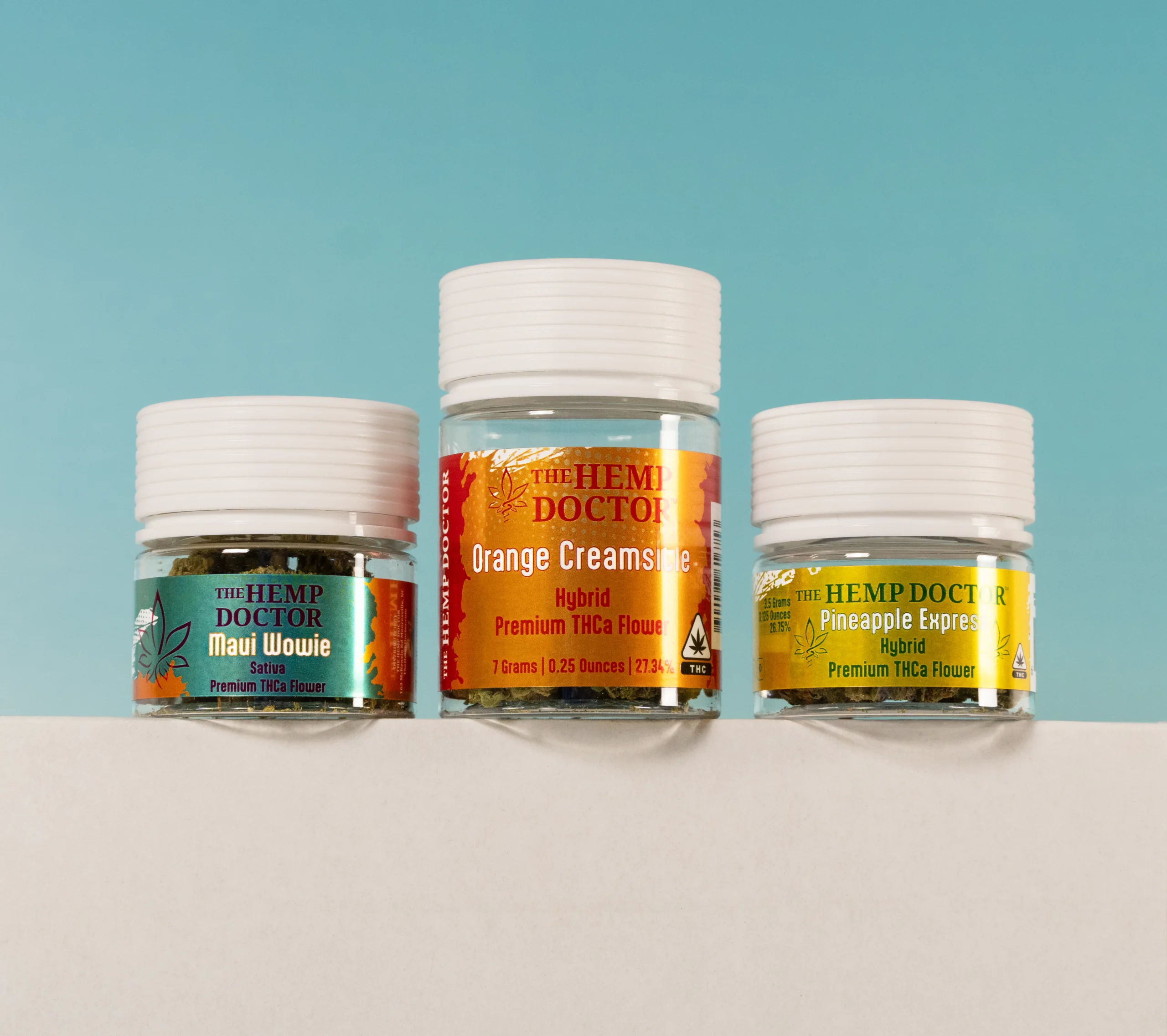 a group of jars containing THCA flower strains