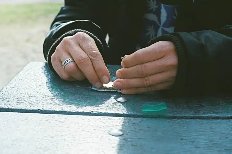 a person rolling a joint