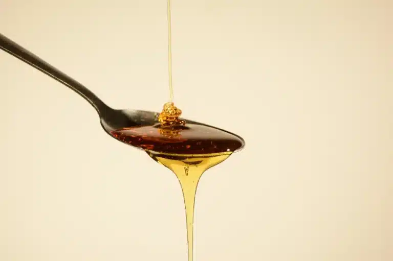 a spoon with THC syrup from it
