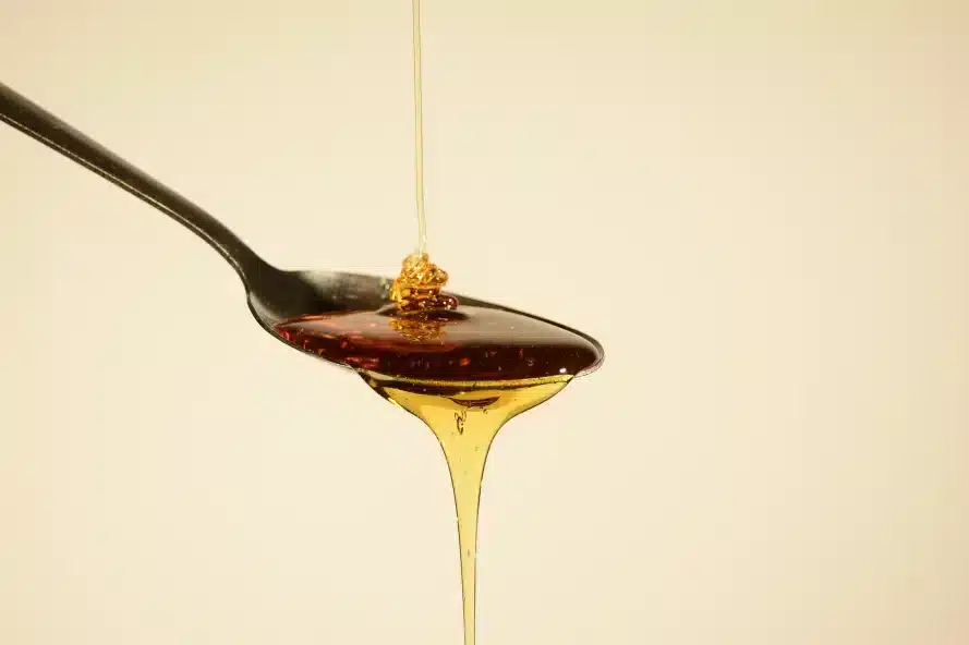 a spoon with THC syrup from it