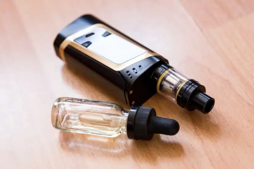 a black and gold electronic vape