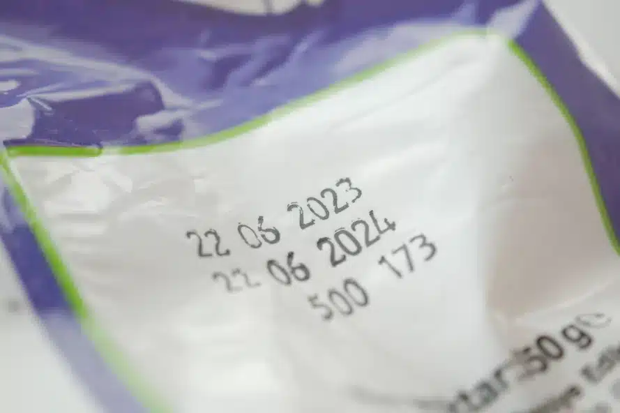 a close-up of a bag labelled with an expiration date