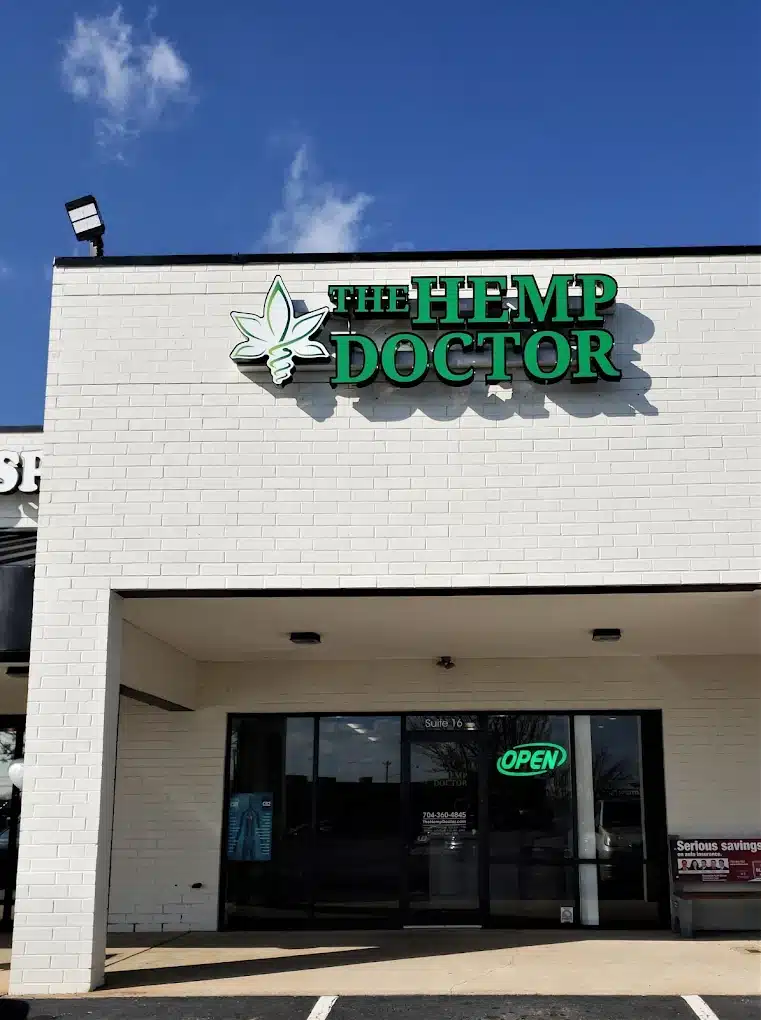 a building with a sign of the hemp doctor on the front