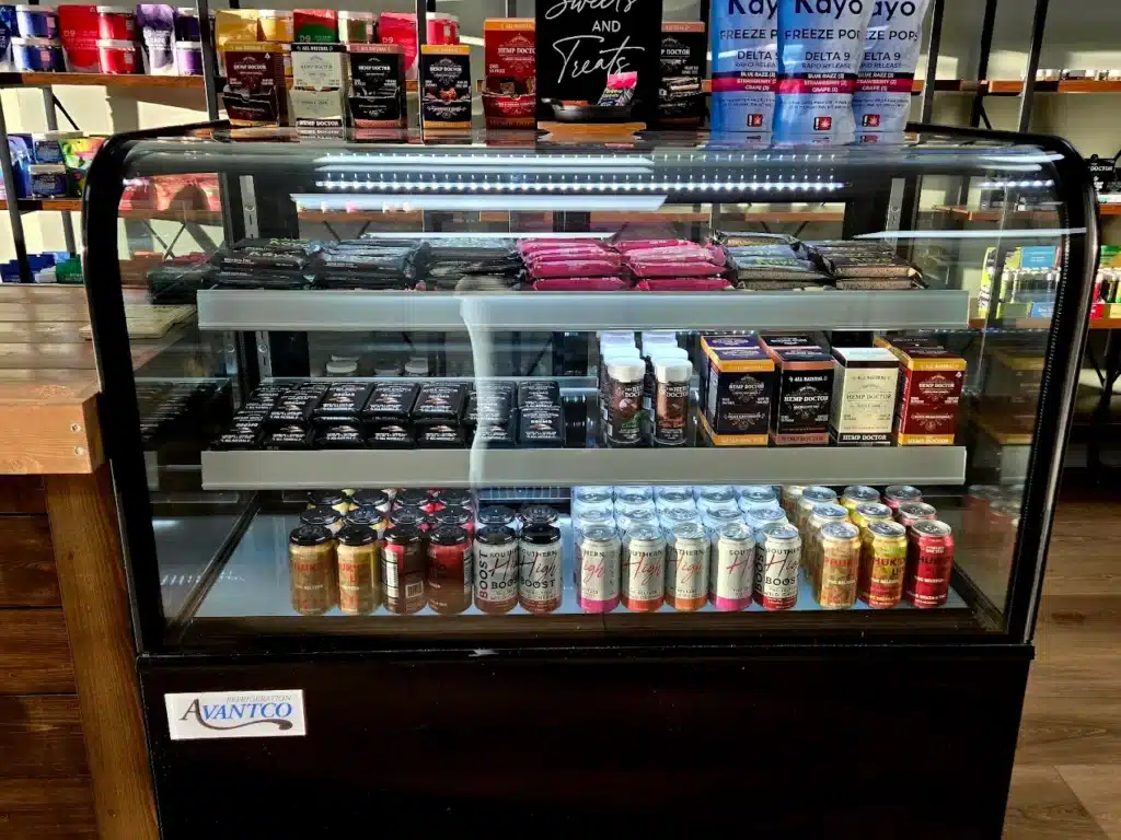 a display case with drinks and beverages