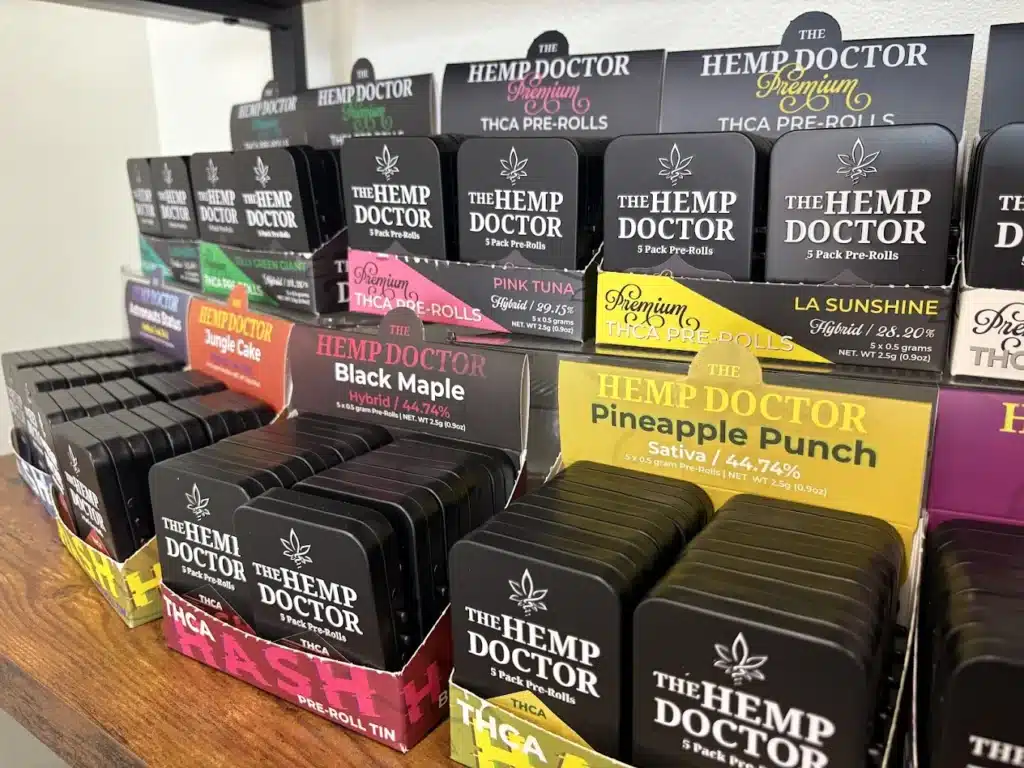 a shelf with boxes of pre rolls