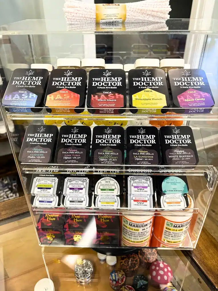 a display case with different types of pre rolls