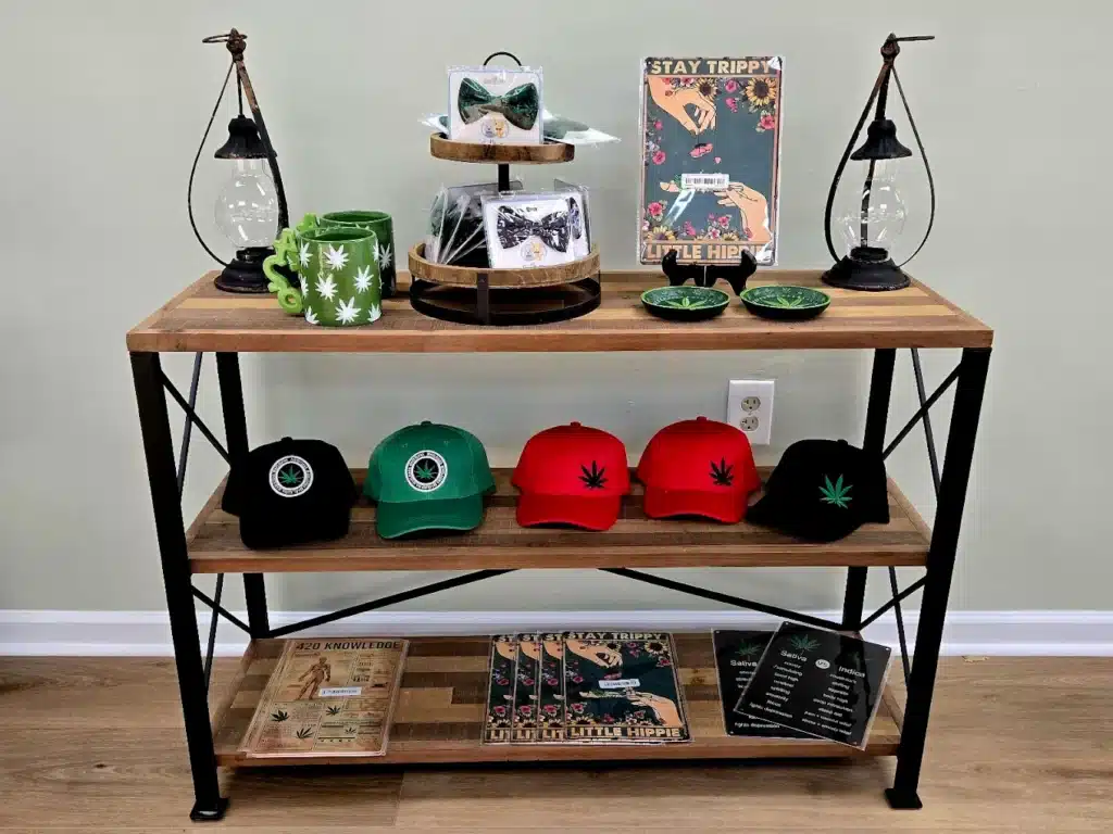 a shelf with hats and other THD merchandise items on it
