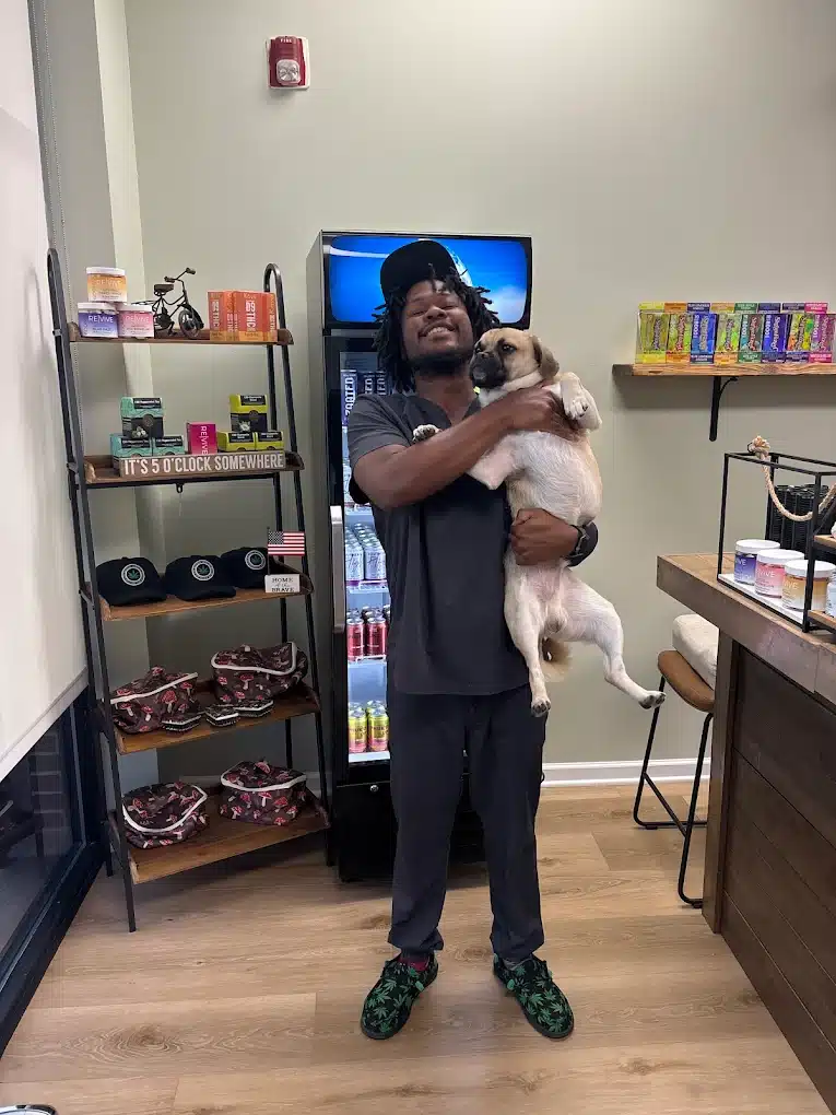 a man holding a dog
