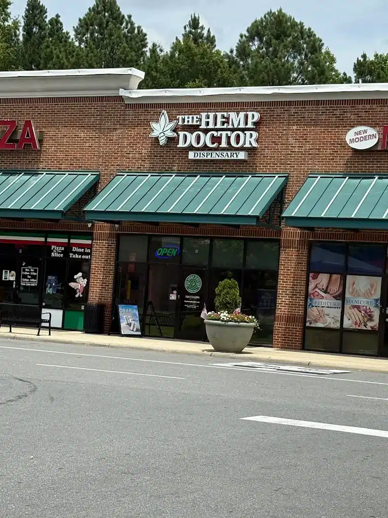 a brick building with awnings and a sign on the front