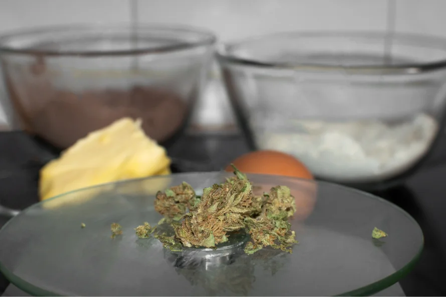 cannabis bud on top of a digital scale 