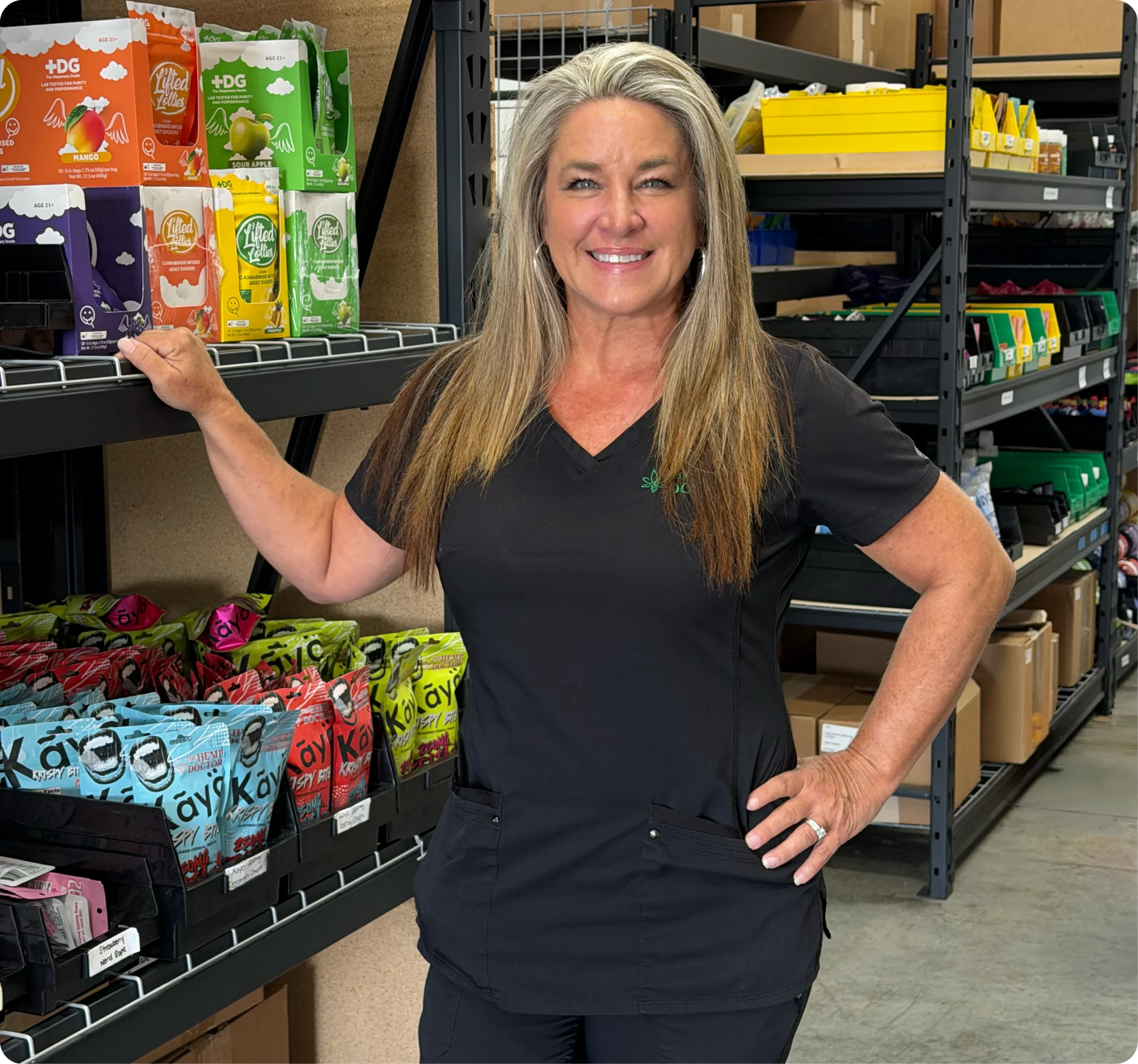 Cindy from The Hemp Doctor team standing beside shelves stocked with hemp products