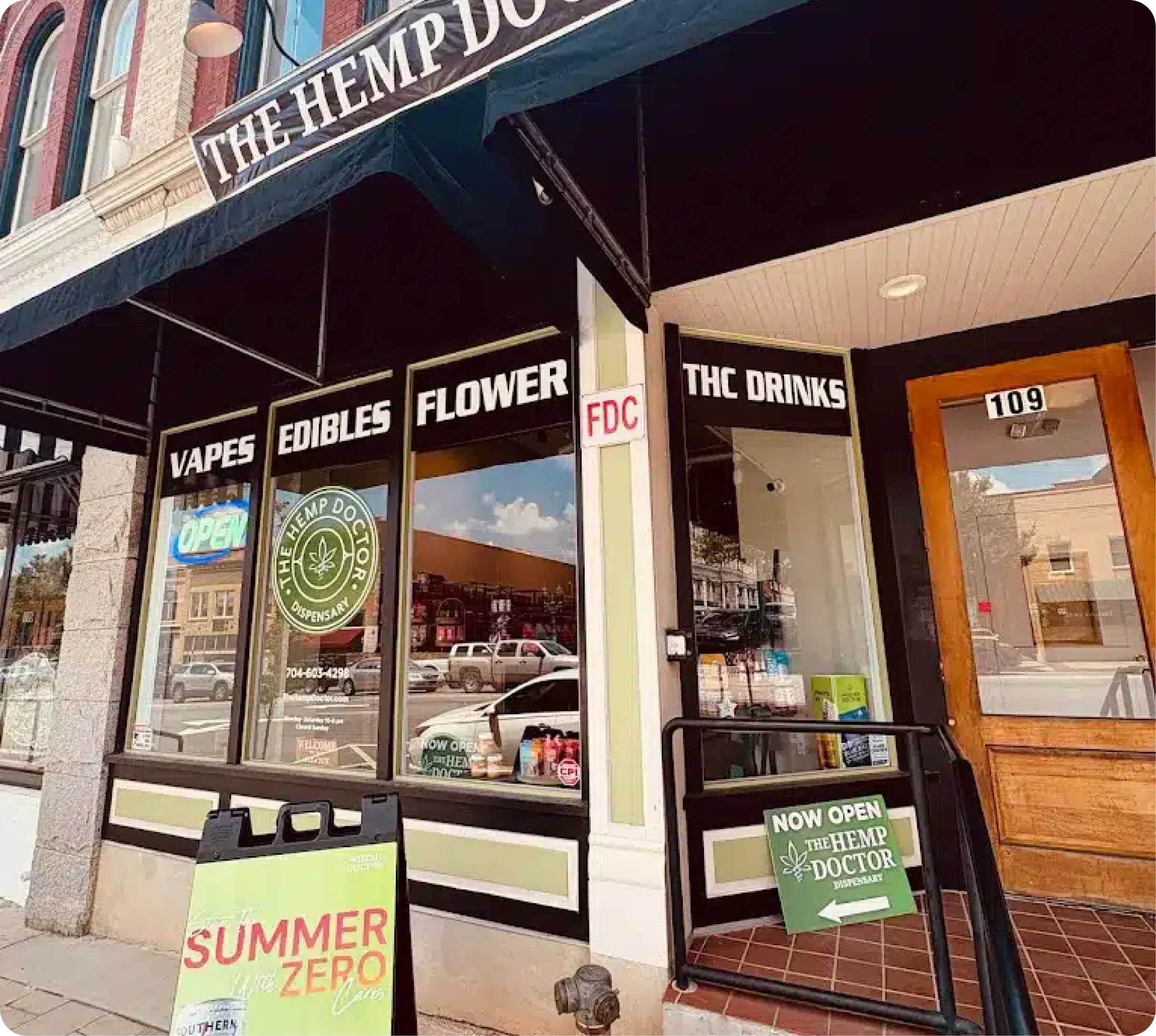 The Hemp Doctor storefront with vapes, edibles, flower and THC drinks signs in the windows