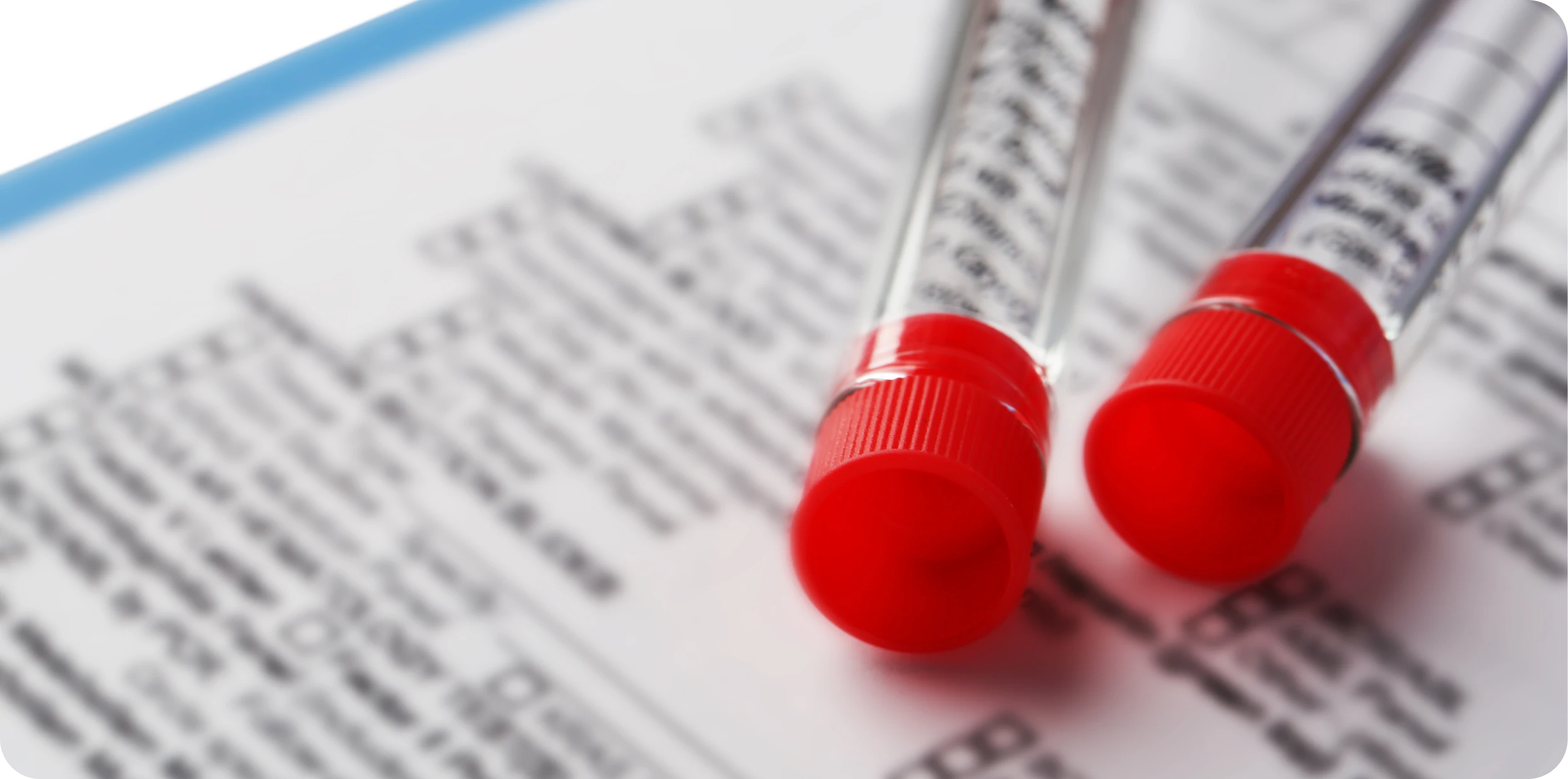 Lab sample tubes resting on a certificate of analysis