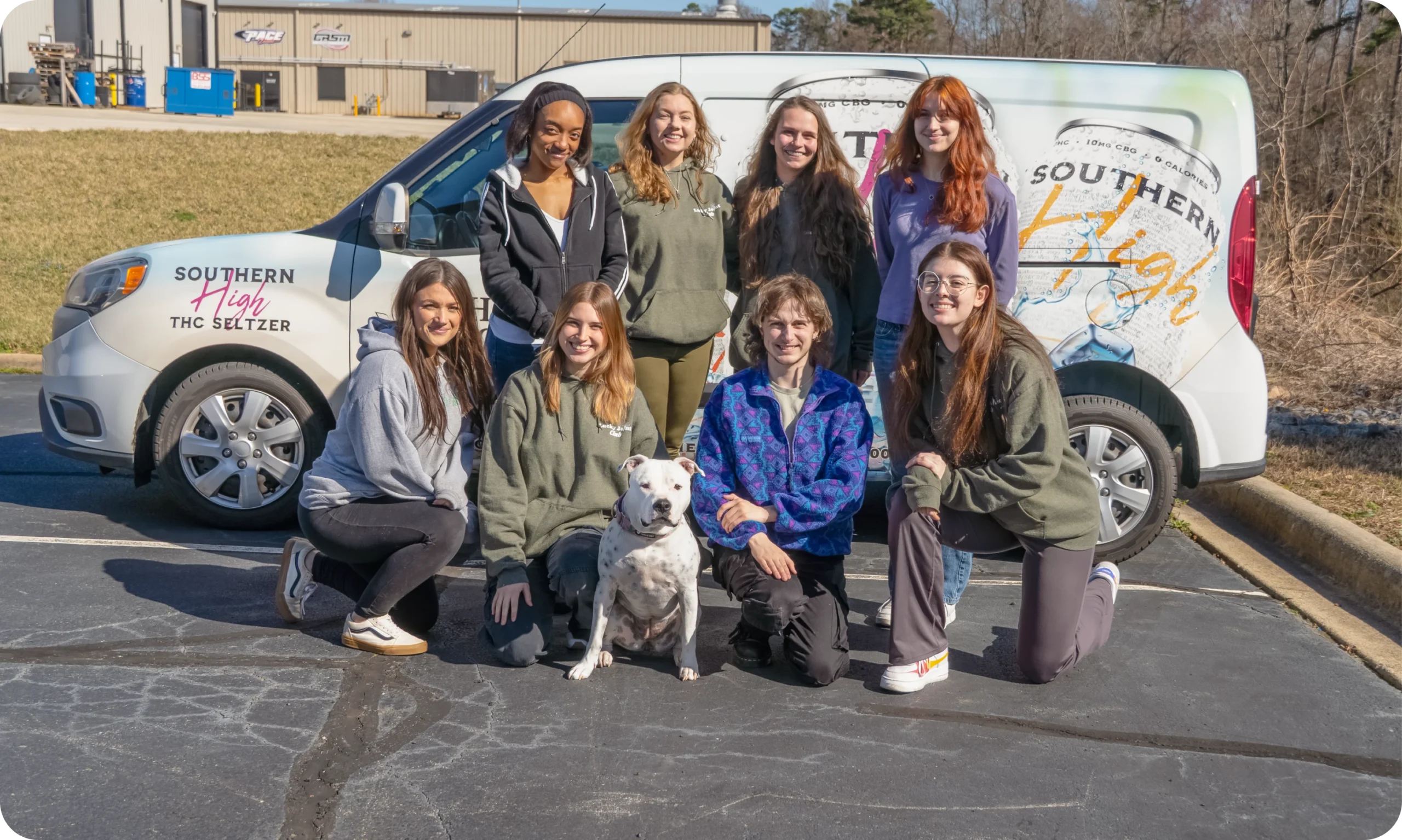 The Hemp Doctor team with their dog in front of the company van