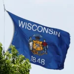 Wisconsin state flag waving outdoors